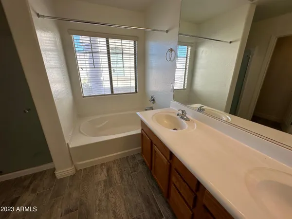 a bathroom with a bathtub a toilet and a shower