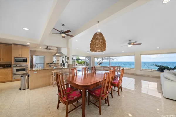 an open kitchen with a table and chairs
