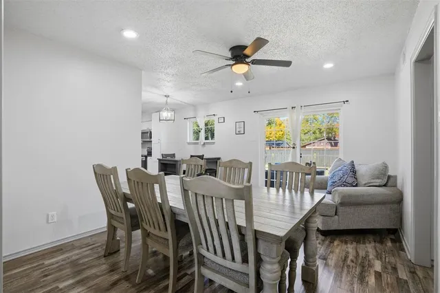 a view of a dining room with furniture and a window