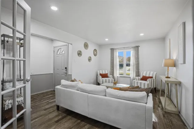 a living room with furniture and a window