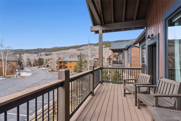 a view of a balcony with furniture