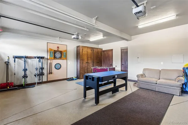 a living room with furniture a rug and a window