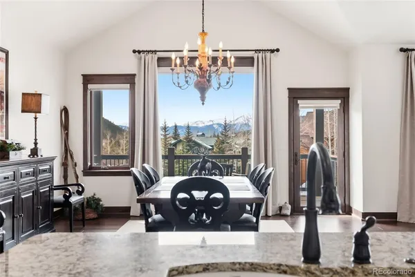 a living room with couch and large windows