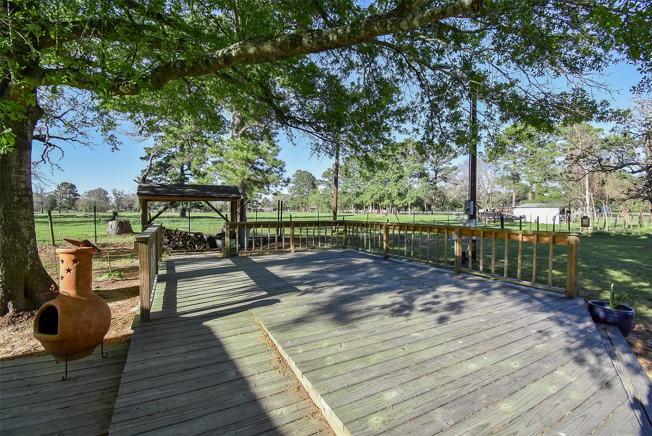 24640 Macedonia Road Hockley, TX 77447 - Photo 43 of 46 a view of a deck with chairs and wooden floor