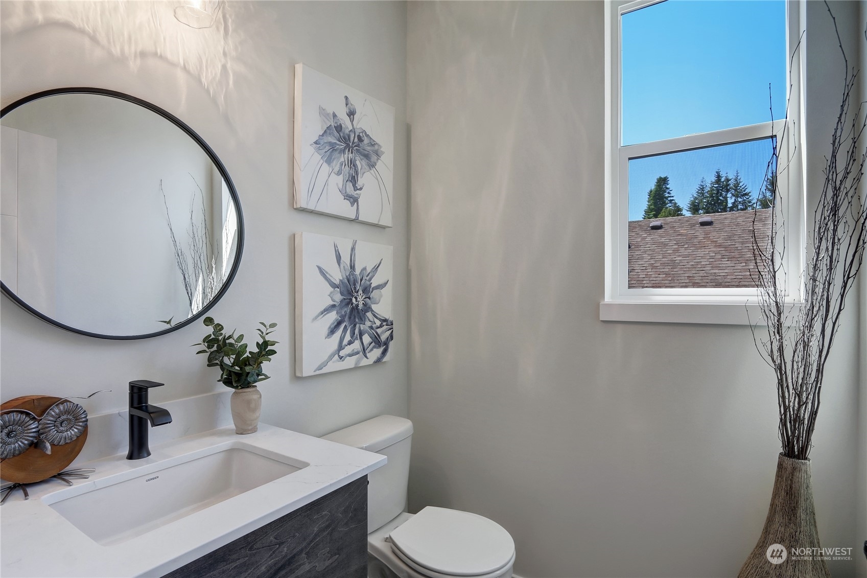 2527 Gibson Road, Unit A6 Everett, WA 98204 - Photo 12 of 24 a bathroom with a toilet a sink and mirror