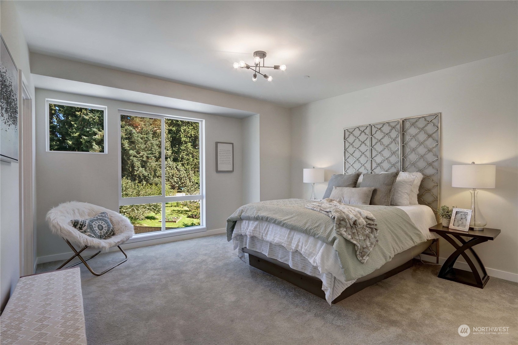 2527 Gibson Road, Unit A6 Everett, WA 98204 - Photo 13 of 24 a spacious bedroom with a bed a chandelier and a window