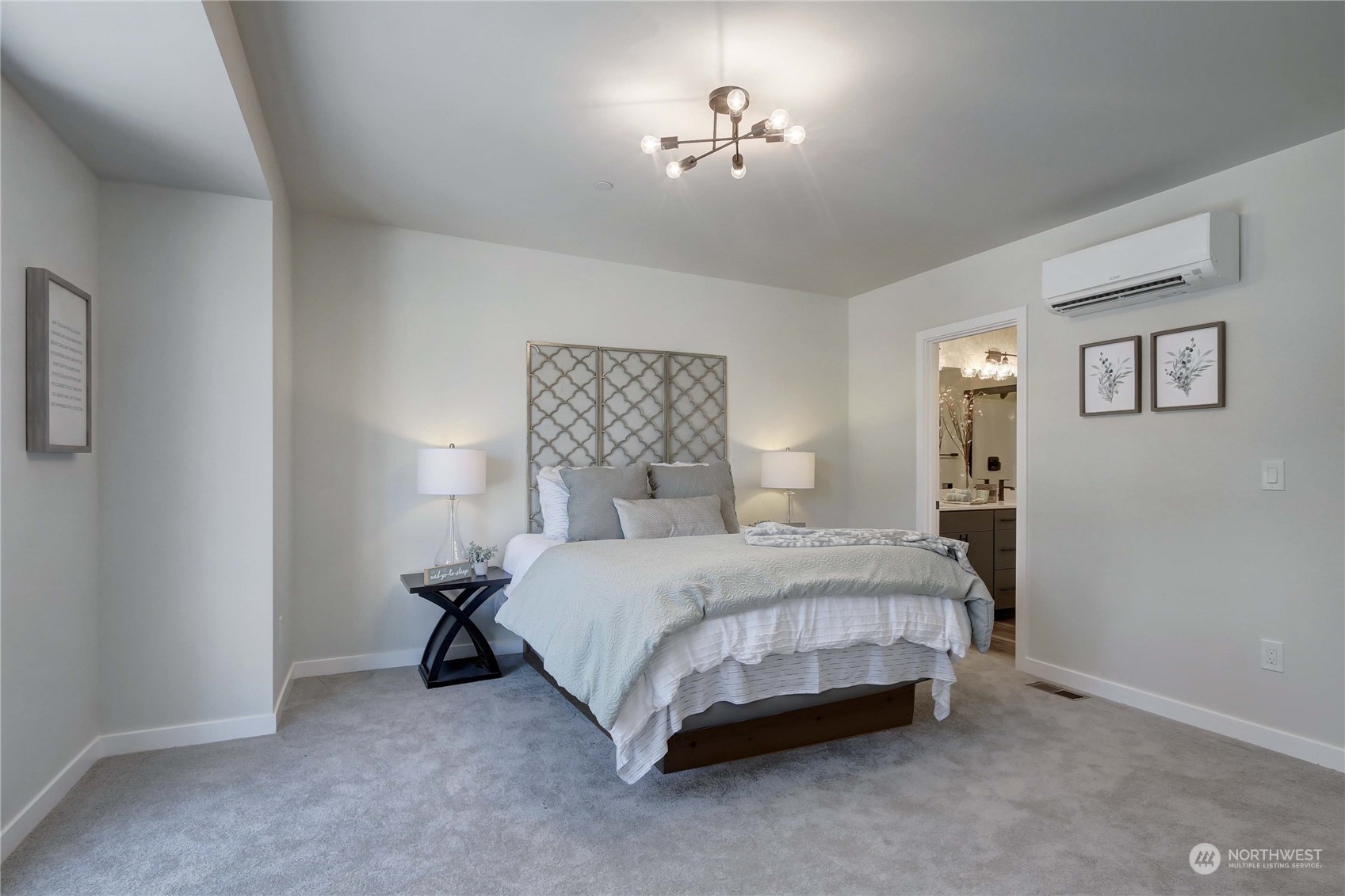 2527 Gibson Road, Unit A6 Everett, WA 98204 - Photo 14 of 24 a spacious bedroom with a bed and a chandelier