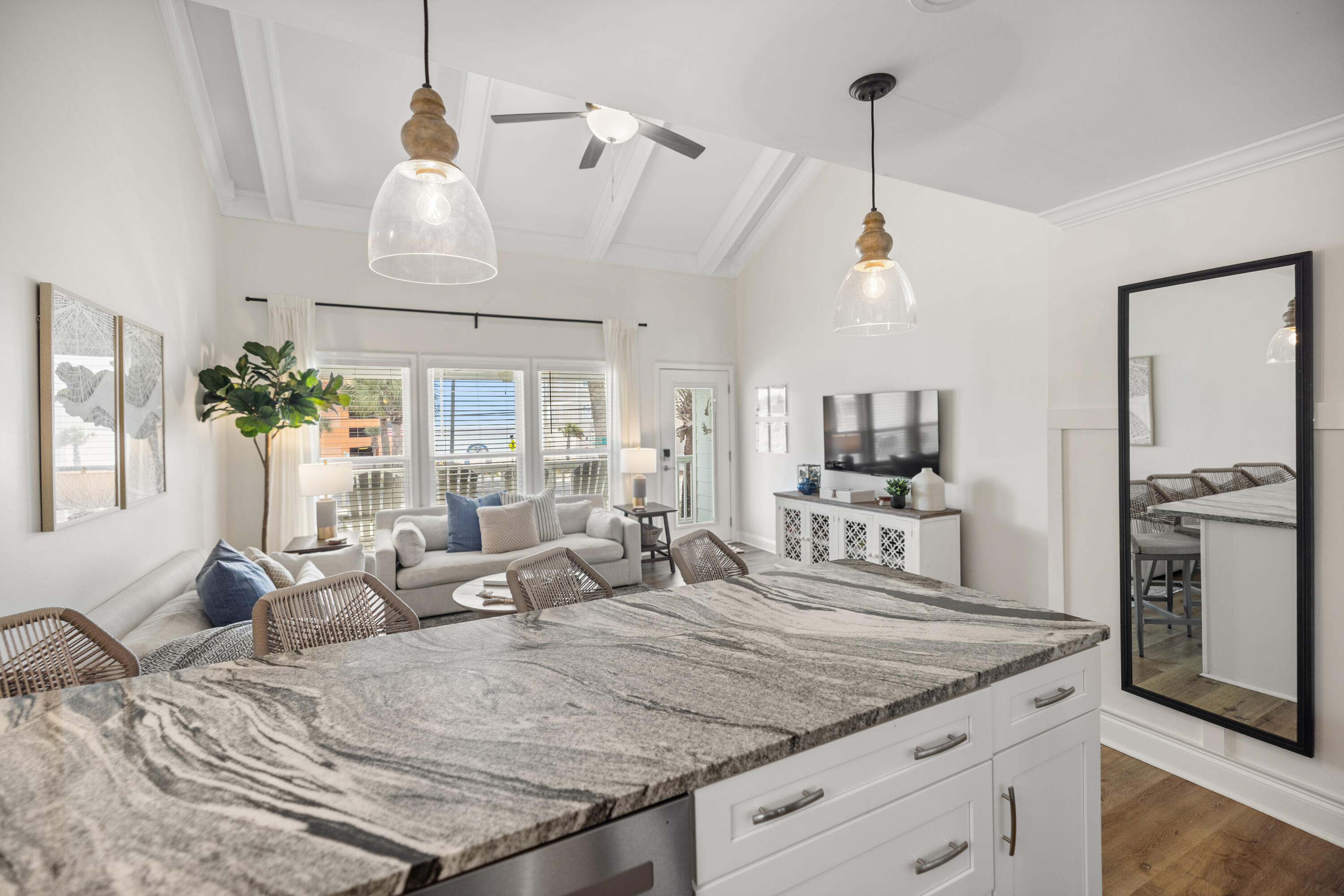 17670 Front Beach Road, Unit L7 Panama City Beach, FL 32413 - Photo 15 of 69 a living room with granite countertop kitchen island furniture and a chandelier
