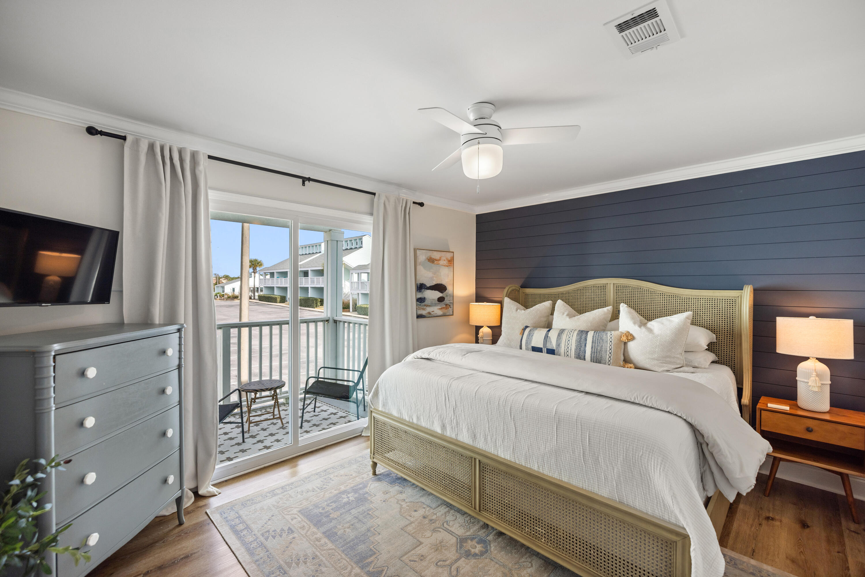 17670 Front Beach Road, Unit L7 Panama City Beach, FL 32413 - Photo 18 of 69 a bedroom with a large bed and a tv