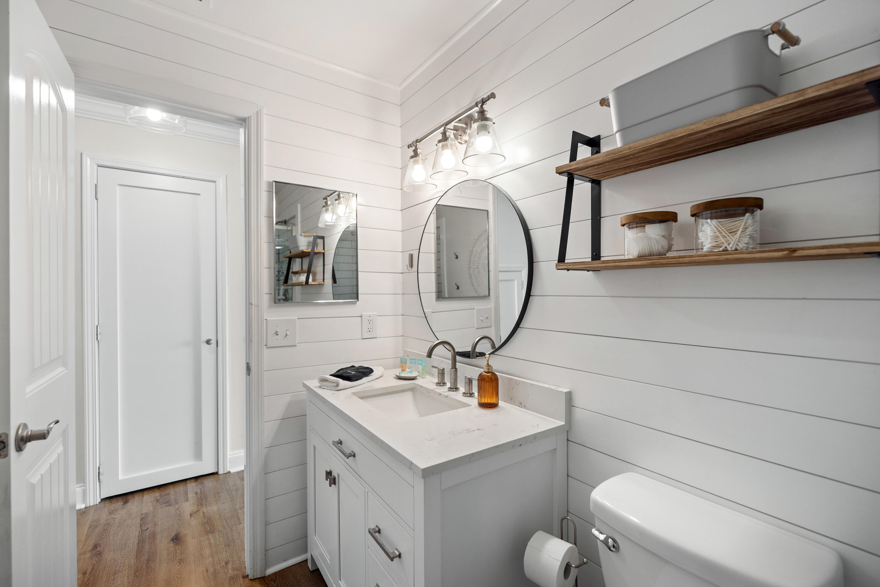 17670 Front Beach Road, Unit L7 Panama City Beach, FL 32413 - Photo 25 of 69 a bathroom with a toilet sink and mirror