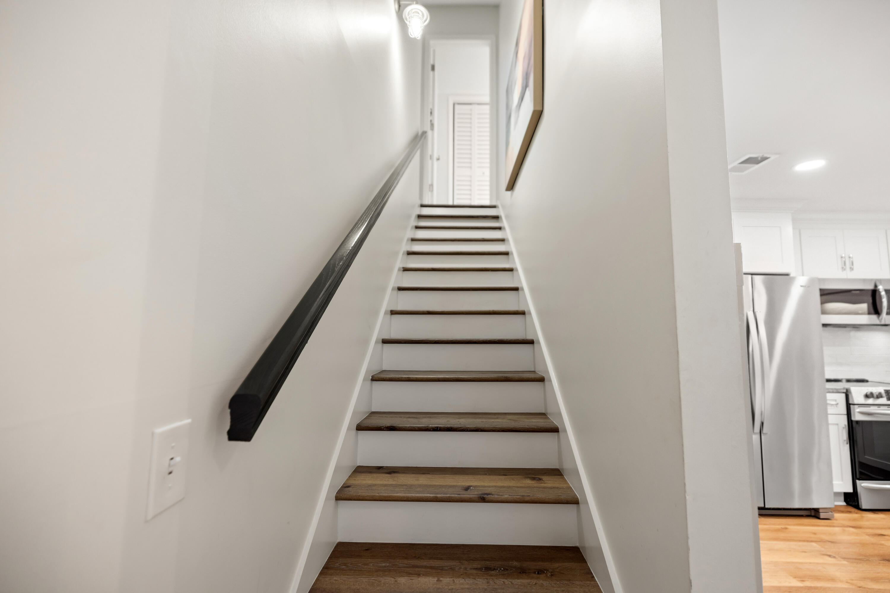 17670 Front Beach Road, Unit L7 Panama City Beach, FL 32413 - Photo 27 of 69 a view of entryway and hall with wooden floor