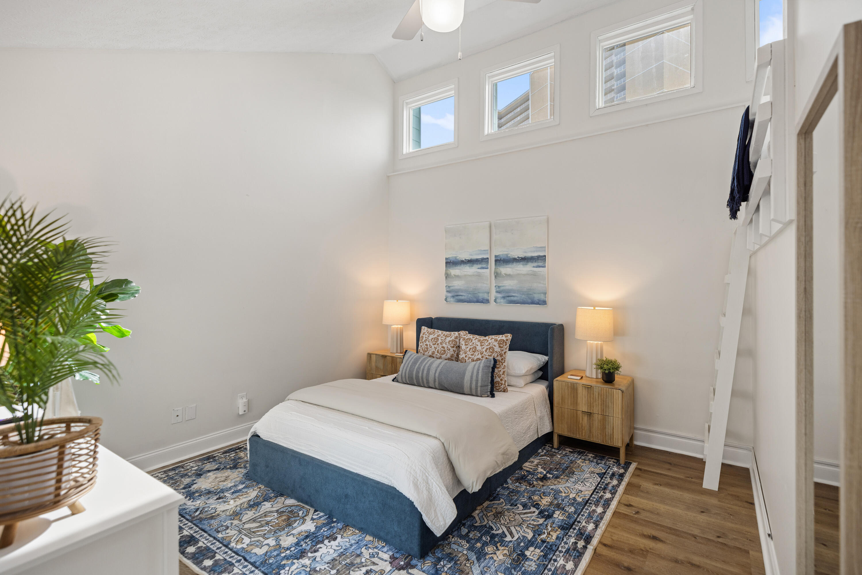 17670 Front Beach Road, Unit L7 Panama City Beach, FL 32413 - Photo 29 of 69 a bedroom with a bed and a potted plant