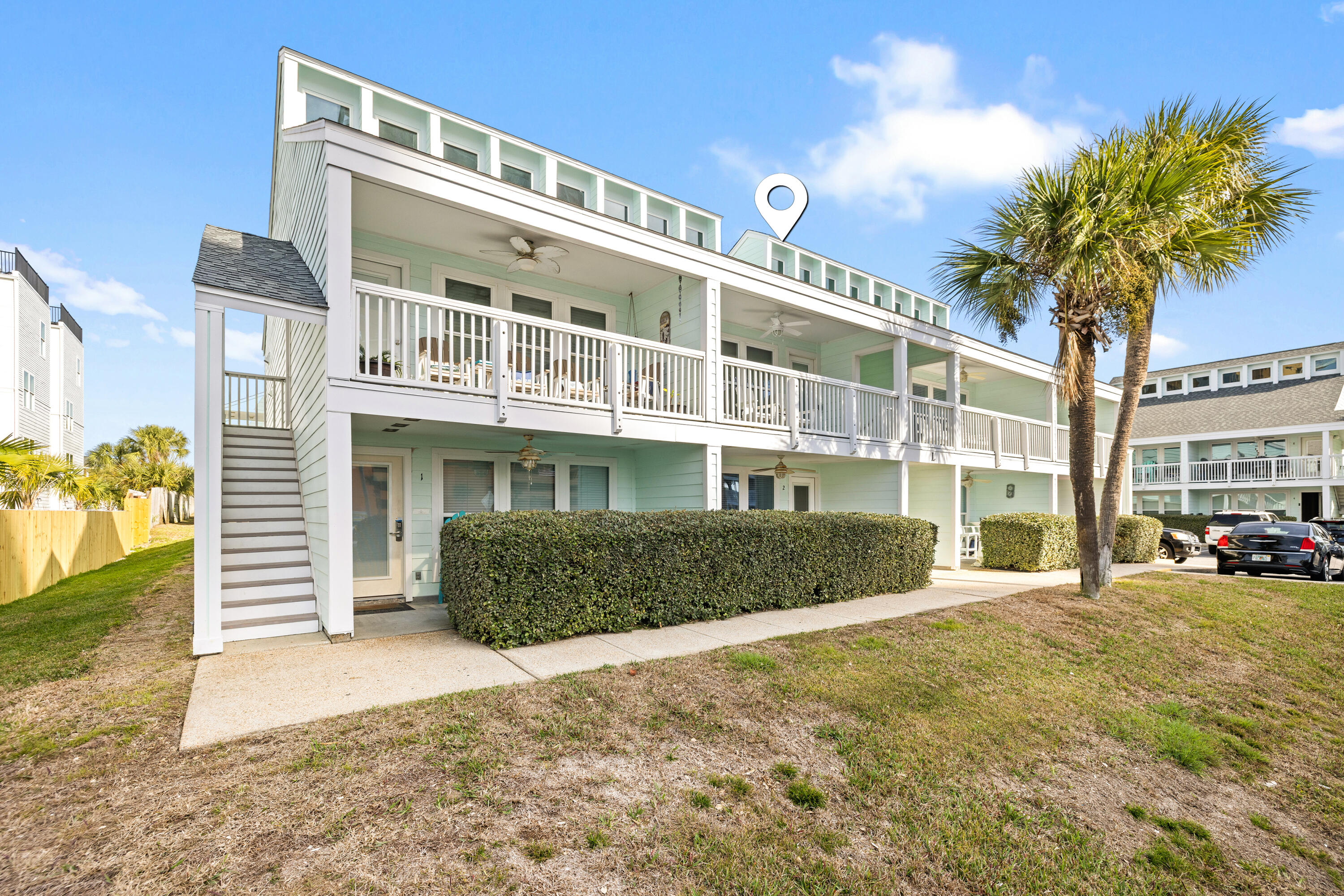 17670 Front Beach Road, Unit L7 Panama City Beach, FL 32413 - Photo 39 of 69 a front view of a house with a yard