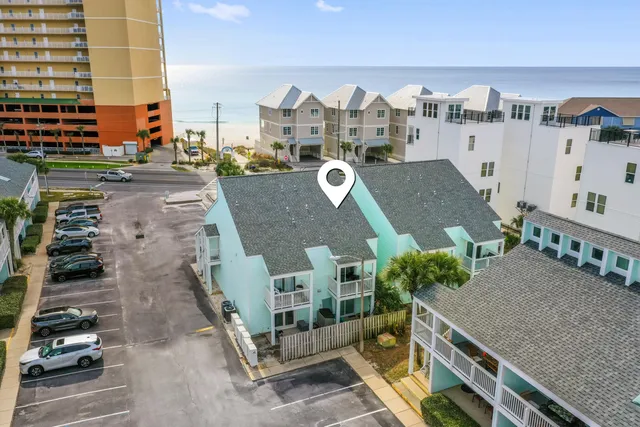 a view of a swimming pool with outdoor seating