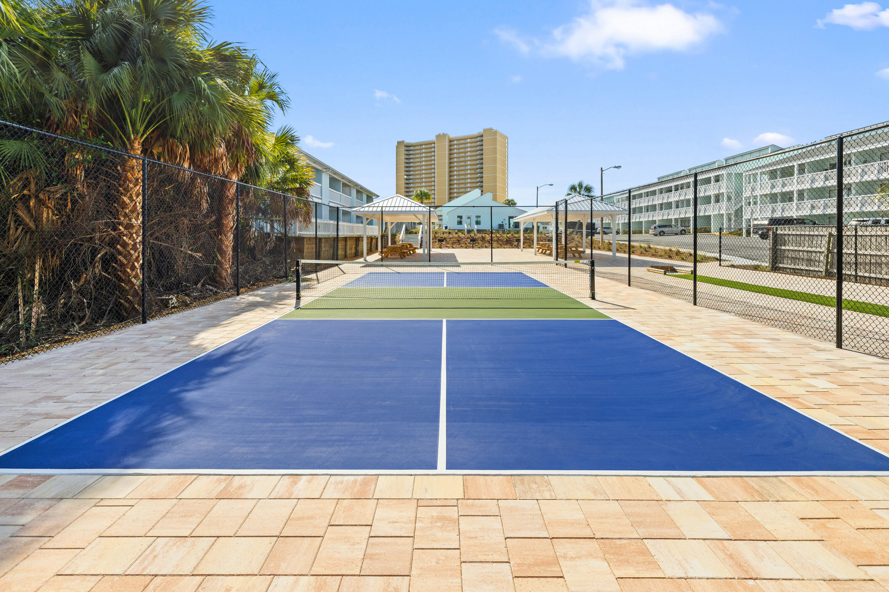 17670 Front Beach Road, Unit L7 Panama City Beach, FL 32413 - Photo 57 of 69 a view of a swimming pool with a lounge chairs