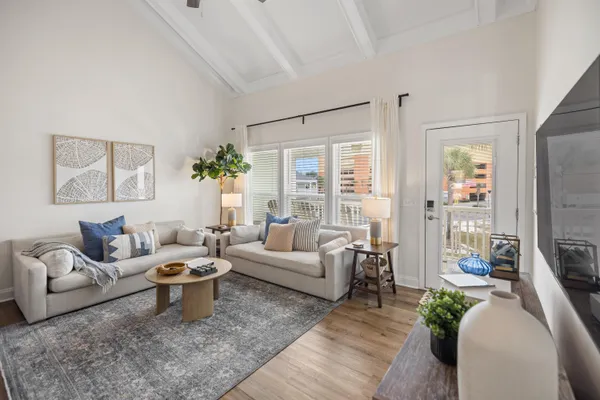 a living room with furniture and a large window