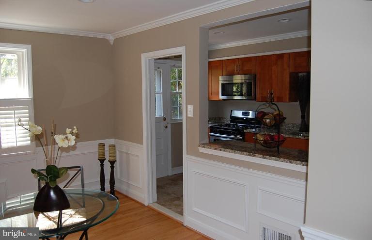 135 Stanmore Road Baltimore, MD 21212 - Photo 11 of 30 a kitchen with a table and chairs in it