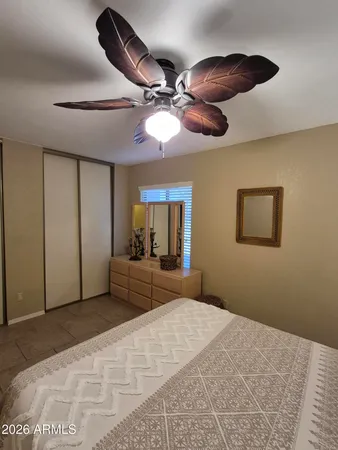 a bathroom with a sink a toilet a mirror and shower