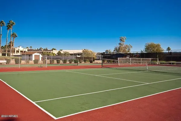 a kitchen with stainless steel appliances granite countertop a sink counter space cabinets and a large window