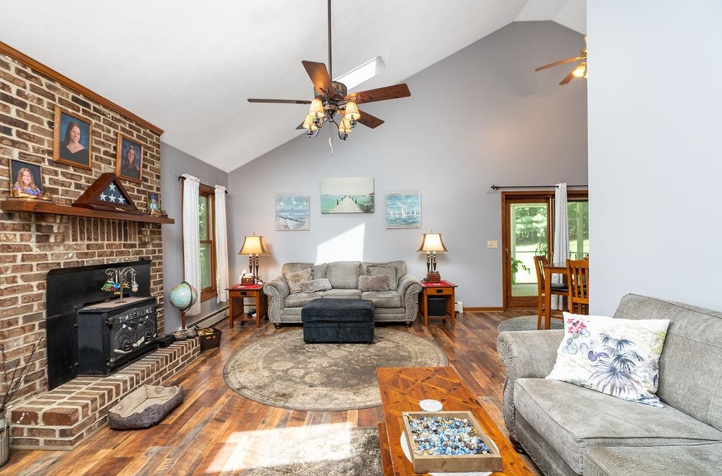 89 Swisher Road Staunton, VA 24401 - Photo 16 of 75 a living room with furniture a fireplace and a flat screen tv