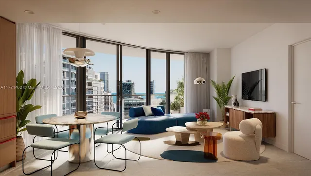 a living room with furniture and a potted plant