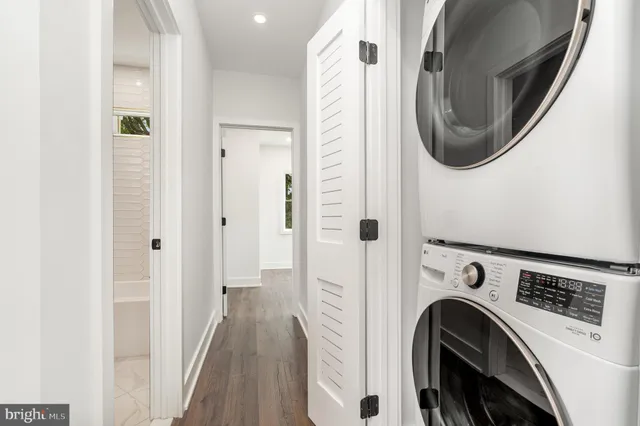 a view of a hallway with washer and dryer