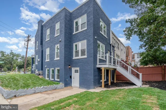 a view of a building with a yard