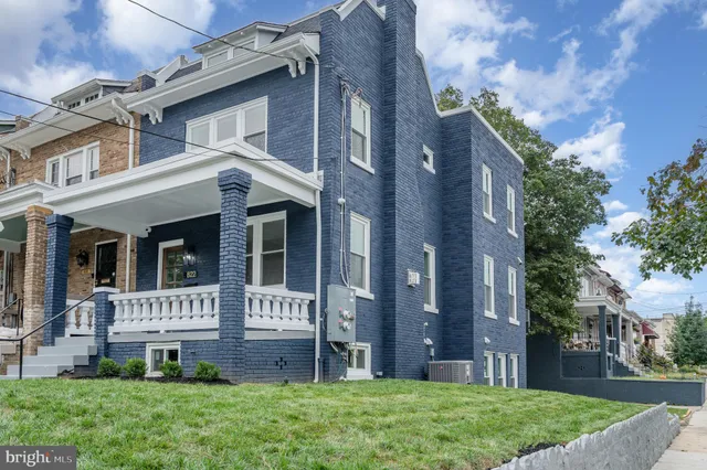 front view of a house with a yard