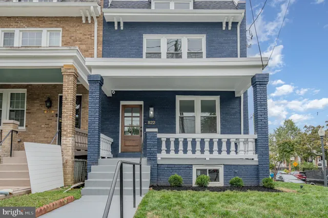 front view of a house with a small yard