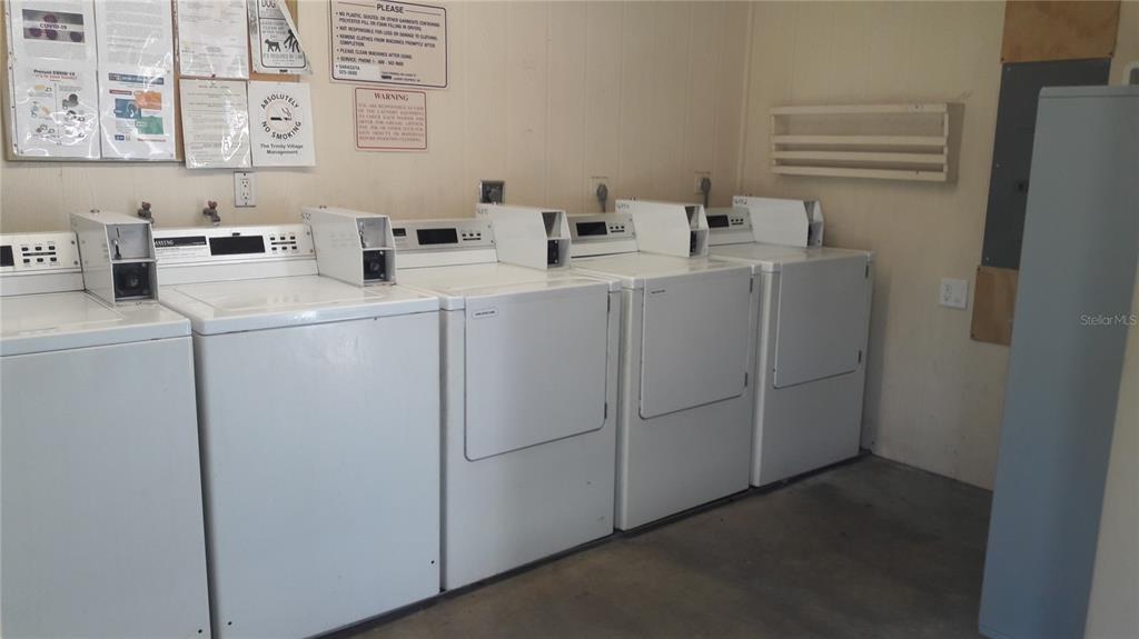 2938 Clark Road, Unit 104 Sarasota, FL 34231 - Photo 16 of 18 a utility room with dryer and washer