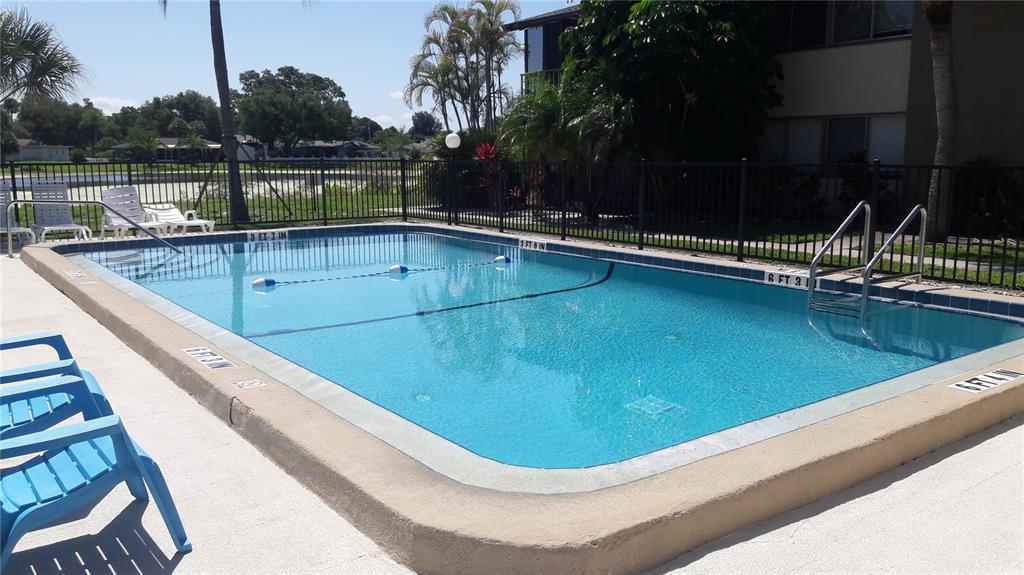 2938 Clark Road, Unit 104 Sarasota, FL 34231 - Photo 17 of 18 a view of a swimming pool from a balcony