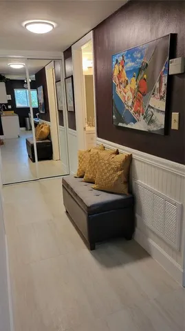 a living room with furniture and wall painting