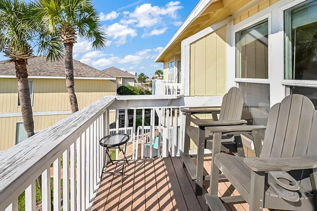 a view of balcony with furniture