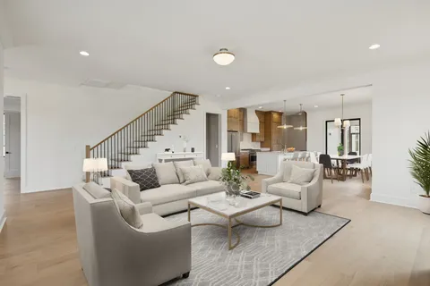 a view of an empty room with a kitchen