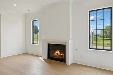 a kitchen with stainless steel appliances granite countertop a refrigerator a sink and a stove