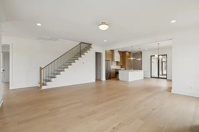 a kitchen with a sink stove and refrigerator