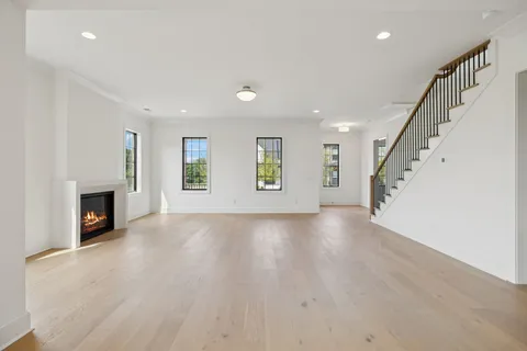 a kitchen with a refrigerator and a stove top oven