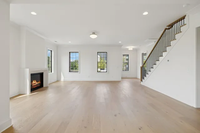 a kitchen with a refrigerator and a stove top oven