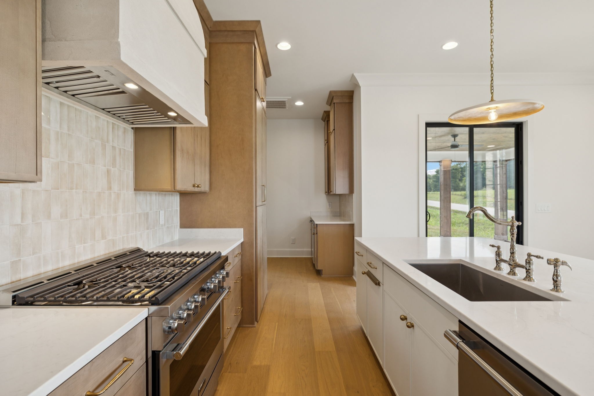 102 Cardiff Dr Spring Hill North Thompson's Station, TN 37179 - Photo 24 of 67 a kitchen with a sink stove and refrigerator