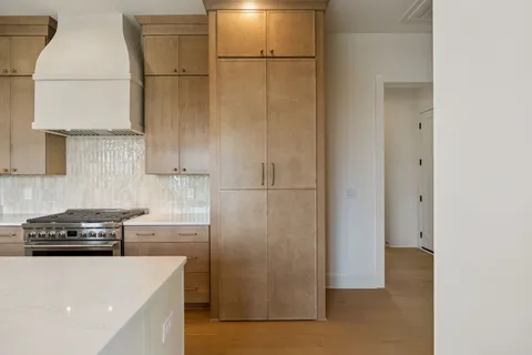a bathroom with a double vanity sink mirror and shower