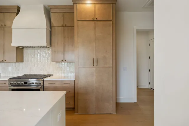 a bathroom with a double vanity sink mirror and shower