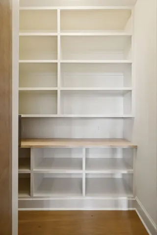 a view of walk in closet with empty room