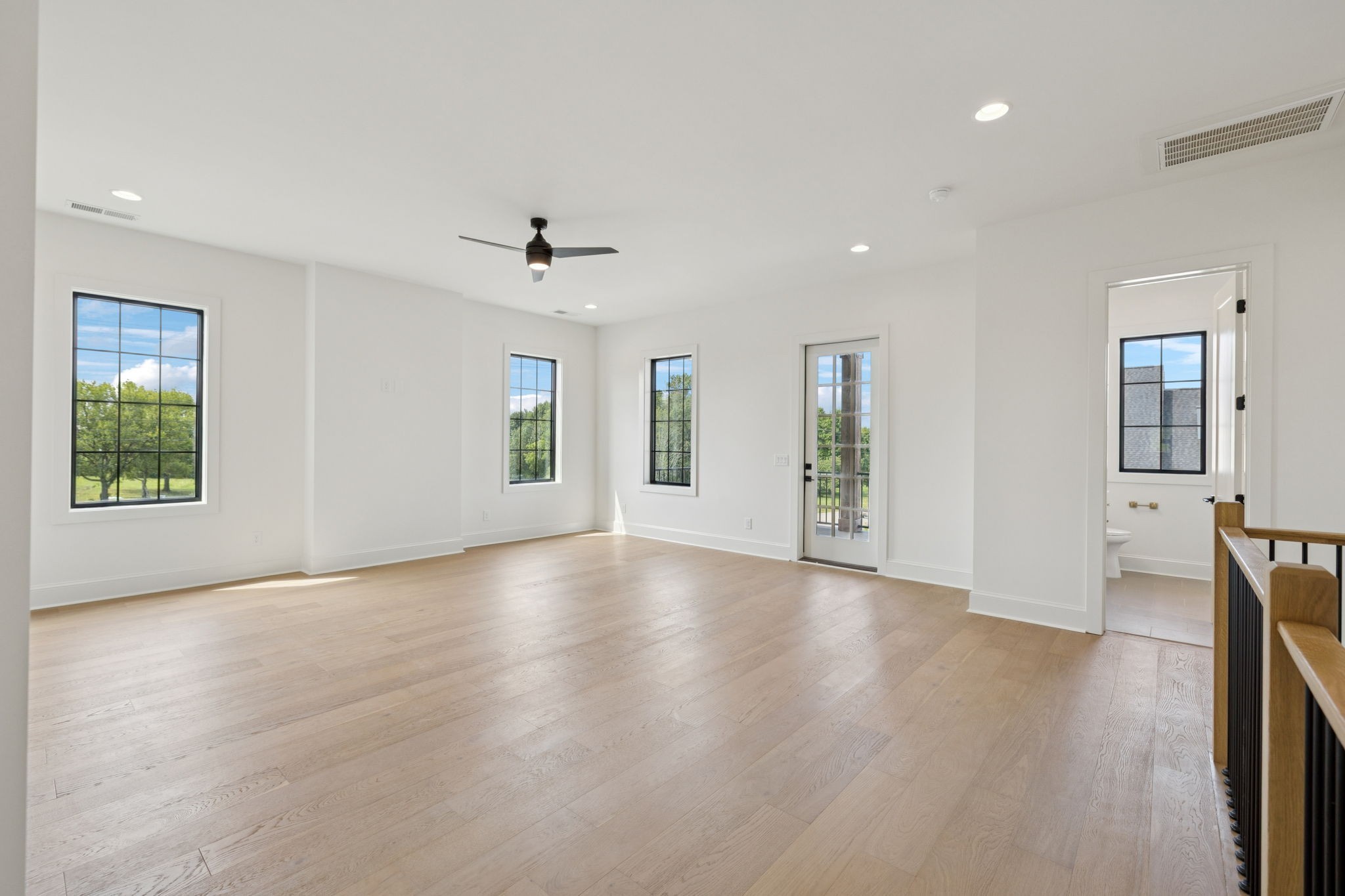 102 Cardiff Dr Spring Hill North Thompson's Station, TN 37179 - Photo 43 of 67 an empty room with wooden floor and windows