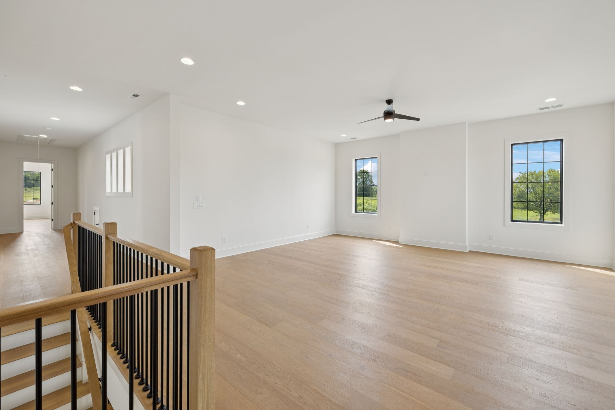 102 Cardiff Dr Spring Hill North Thompson's Station, TN 37179 - Photo 44 of 67 a view of an empty room with window and wooden floor