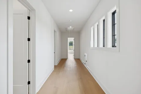 a view of a wooden door and wooden floor