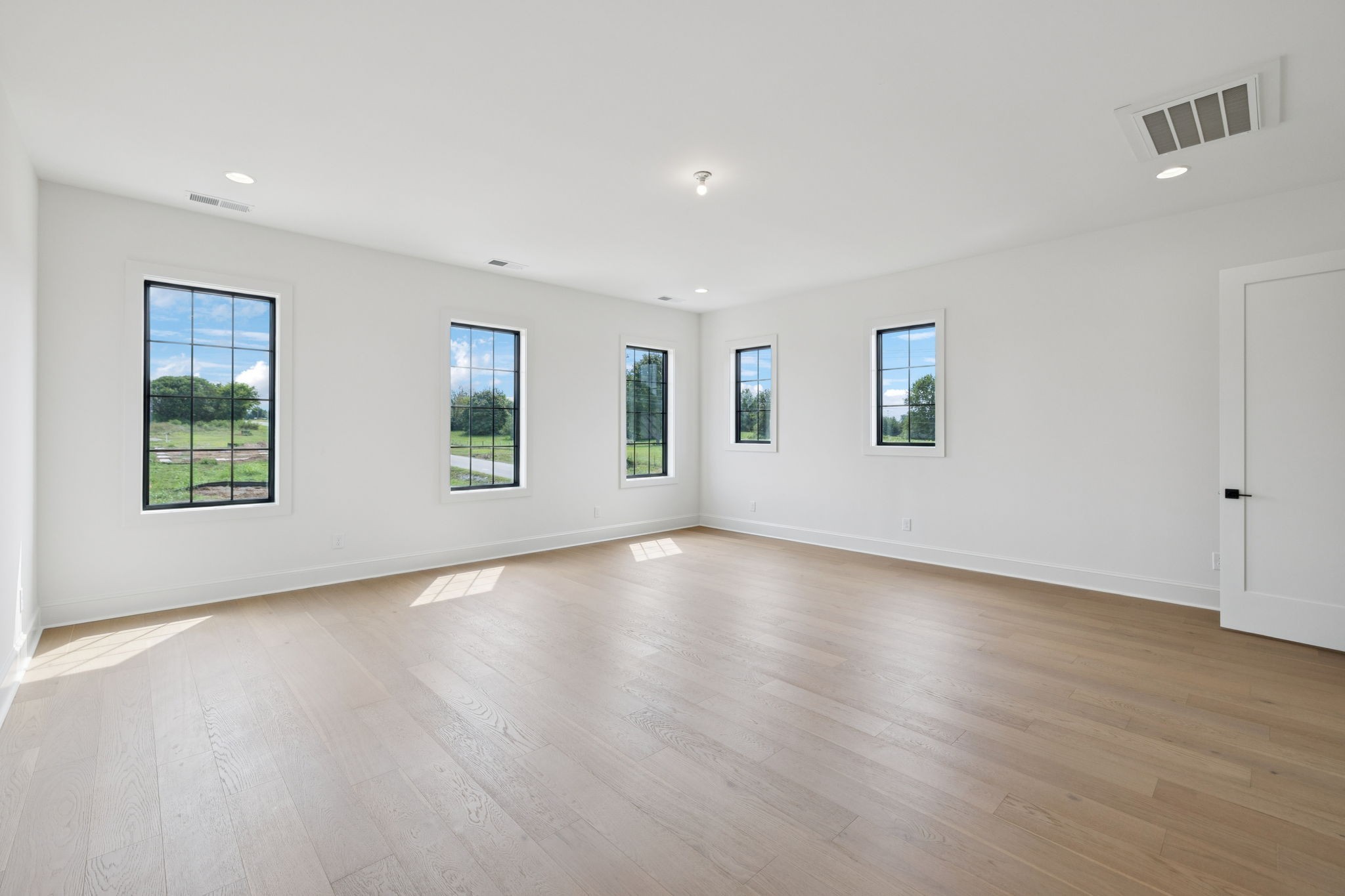 102 Cardiff Dr Spring Hill North Thompson's Station, TN 37179 - Photo 57 of 67 a view of an empty room with wooden floor and a window