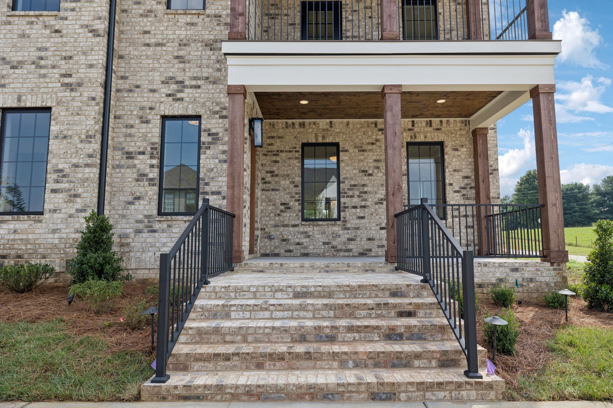 102 Cardiff Dr Spring Hill North Thompson's Station, TN 37179 - Photo 6 of 67 a front view of a house with a garden