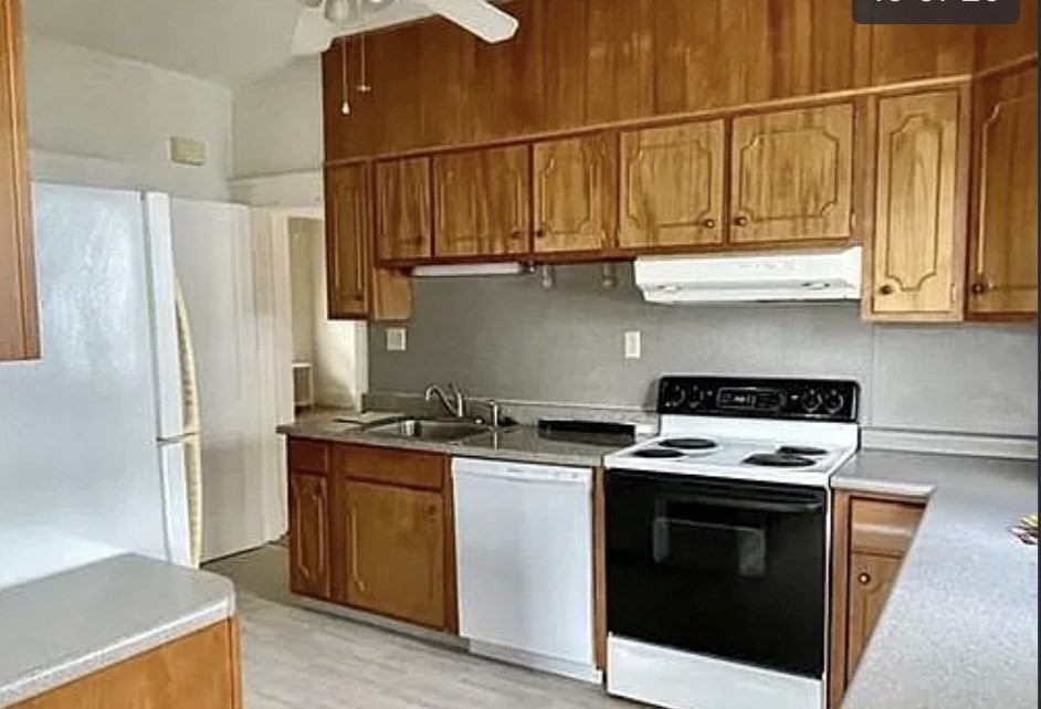 24 Somerset Street, Unit 2 Worcester, MA 01609 - Photo 3 of 16 a kitchen with stainless steel appliances granite countertop a stove a refrigerator and a microwave