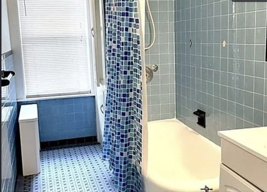 24 Somerset Street, Unit 2 Worcester, MA 01609 - Photo 8 of 16 a bathroom with a bathtub and shower