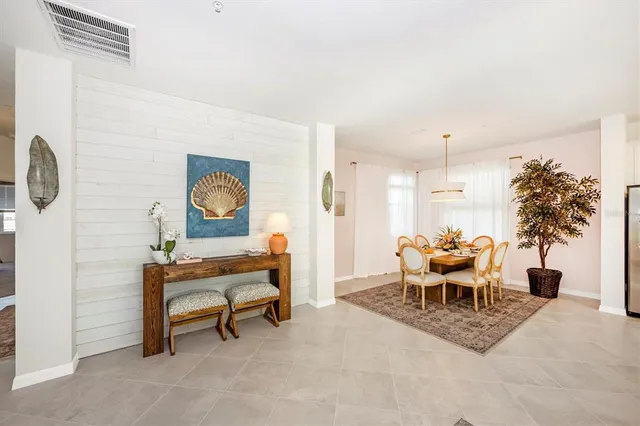 a living room with furniture and kitchen view